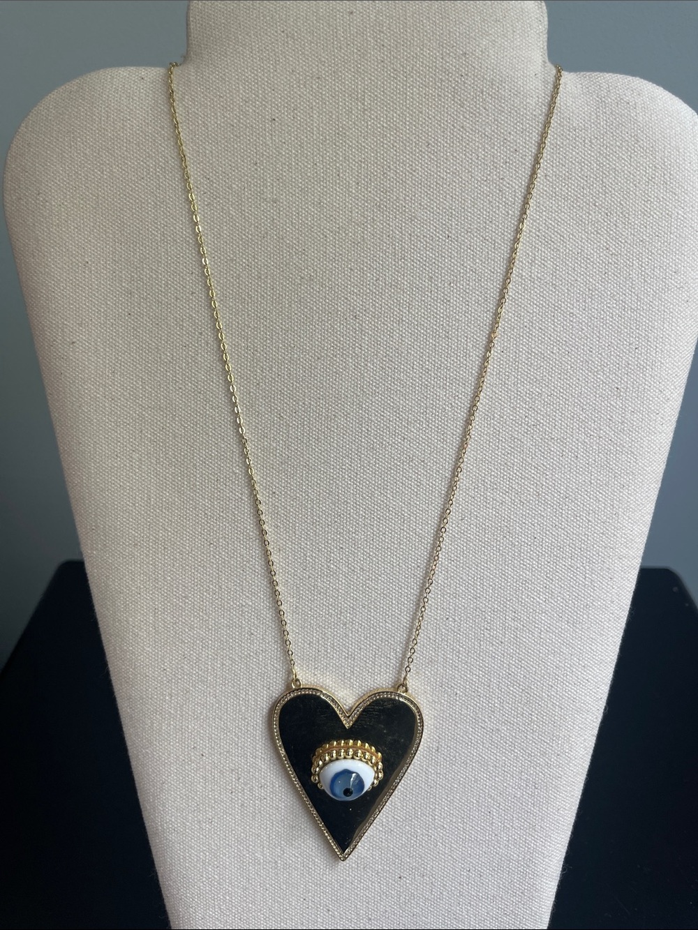 Gold Heart Pendant Necklace with Black Enamel and Blue Eye Accent